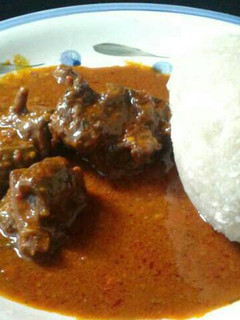 A picture of Plain ogbono soup and goat meat.