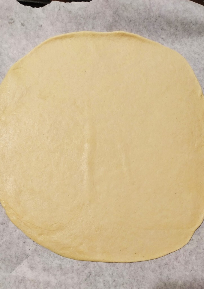 Una foto de Masa de pizza fina y crujiente