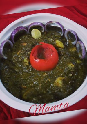 A picture of Aloo Palak with gravy.