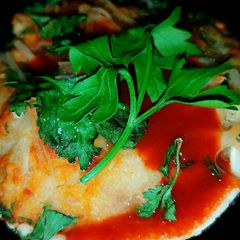 A picture of Mike's Giant Seafood Stuffed Quahog Grilled Clams.
