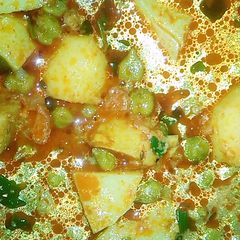 A picture of Potato green chhole (chickpeas).