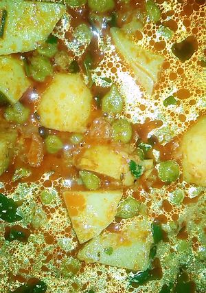 A picture of Potato green chhole (chickpeas).