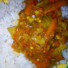 A picture of White rice with potato's soup.