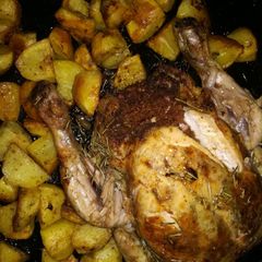 A picture of Stuffed chicken with potatoes.