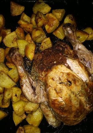 A picture of Stuffed chicken with potatoes.