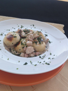 Una foto de Ñoquis rellenos con muzzarella