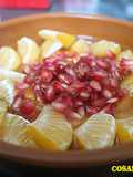 Postre de palosanto, mandarina y granada