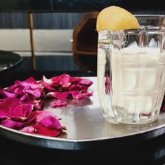 Chikoo shake with rose petals A picture of Chikoo shake with rose petals.