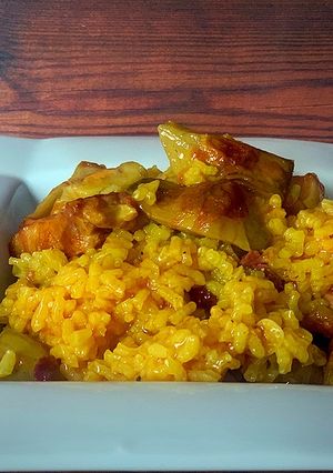 Una foto de Arroz alla arrabbiata con alcachofa y panceta