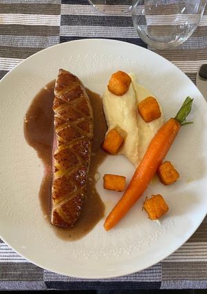 A picture of Duck Breast with Honey, Parsnip Purée, Glazed Carrots, Parsnip Purée, and Roasted Butternut Squash.