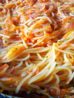 A picture of Stir fry Spaghetti with marinara sauce.