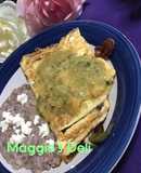 Omelette de tocino y pimientos bañada con salsa verde con habanero
