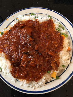 A picture of Yummy rice with stew.