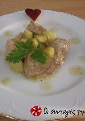 A picture of Pork tenderloin with apples.