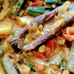 A picture of Bhindi Curry with mustard paste.