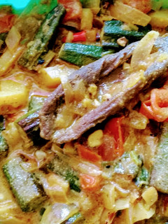 A picture of Bhindi Curry with mustard paste.