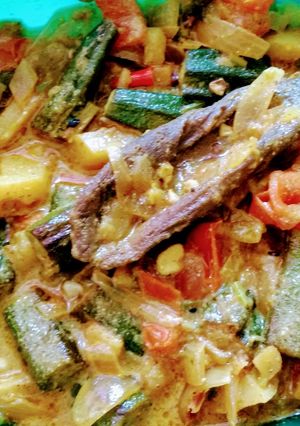 A picture of Bhindi Curry with mustard paste.