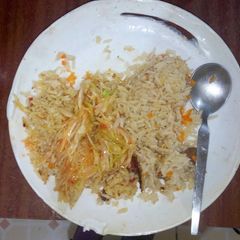 A picture of Pilau and Fried Cabbage.