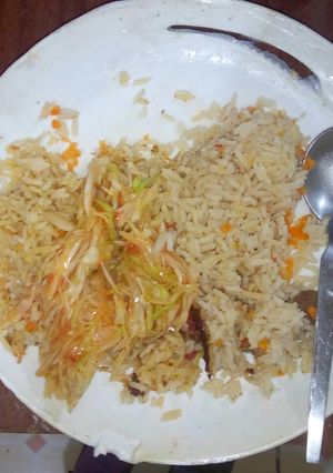 A picture of Pilau and Fried Cabbage.