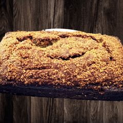 A picture of Moist Banana Bread w/Toasted Coconut topping.