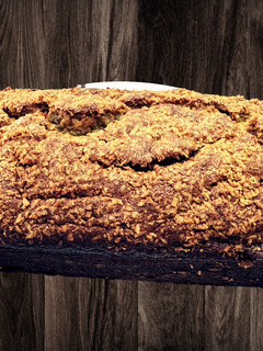A picture of Moist Banana Bread w/Toasted Coconut topping.