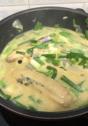 A picture of Herring Fillet In Mustard Sauce With Scallion.