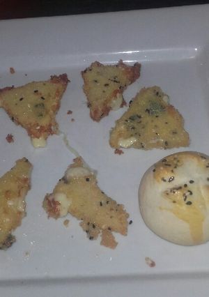 Una foto de Triángulos de muzzarella