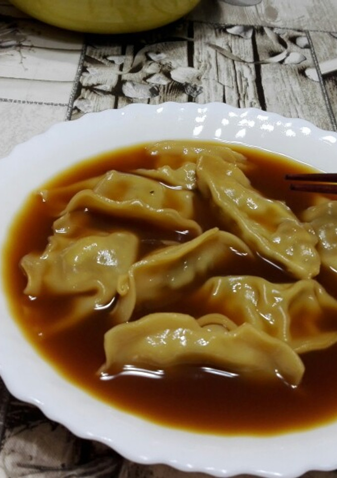 Una foto de Sopa gyozas