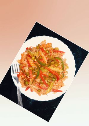A picture of Pasta with green veggies and schezwan chutney.