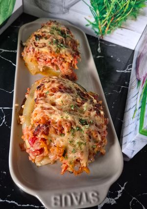 A picture of Stuffed Zucchini Gratin in a Dutch Oven.