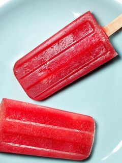 A picture of Homemade watermelon popsicles.