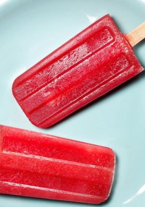 A picture of Homemade watermelon popsicles.