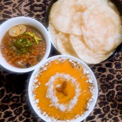 Halwah puri with choly gravy A picture of Halwah puri with choly gravy.
