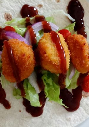 A picture of How to please the kiddies BBQ and chicken nugget wraps.