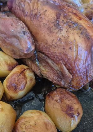 A picture of Roast Chicken with Oven-Roasted Potatoes.