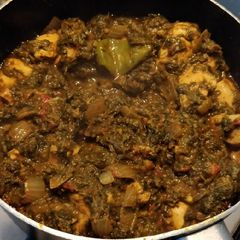 A picture of Chicken Palak (chicken spinach curry).