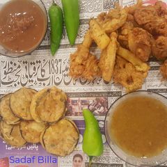 A picture of Baingan pakora,Aloo pyaz pakora.