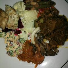 A picture of Delicious beef stew,fried fish and salads.