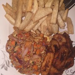 A picture of Fried yam with plantain and egg sauce.