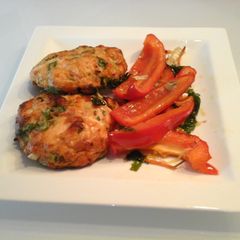 A picture of Salmon burgers with Roasted Veggies.