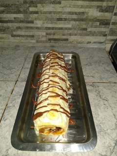 Una foto de Pionono con dulce de leche y bananas