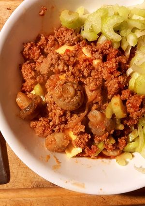 A picture of Sweet sour Mushroom mince meat served with cheese and celery toppings.