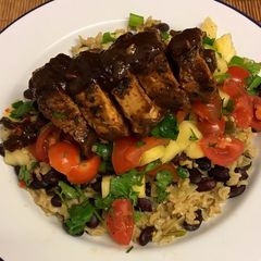 A picture of Jerk glazed pork fillet, pineapple salsa, rice and peas 🇯🇲.