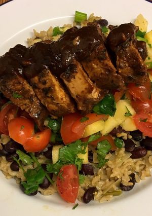 A picture of Jerk glazed pork fillet, pineapple salsa, rice and peas 🇯🇲.