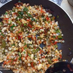 A picture of Sago pearls with colourful veggies.