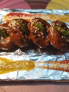 A picture of Veggy Suji Potato Snacks(With Hot and Sweet Garlic sauce).