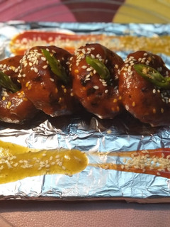 A picture of Veggy Suji Potato Snacks(With Hot and Sweet Garlic sauce).
