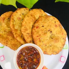 Patheera with onion sauce A picture of Patheera with onion sauce.