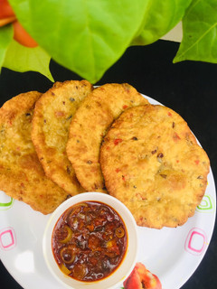 A picture of Patheera with onion sauce.
