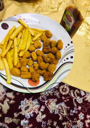 A picture of French fries & chicken popcorns#Ramzsn special.